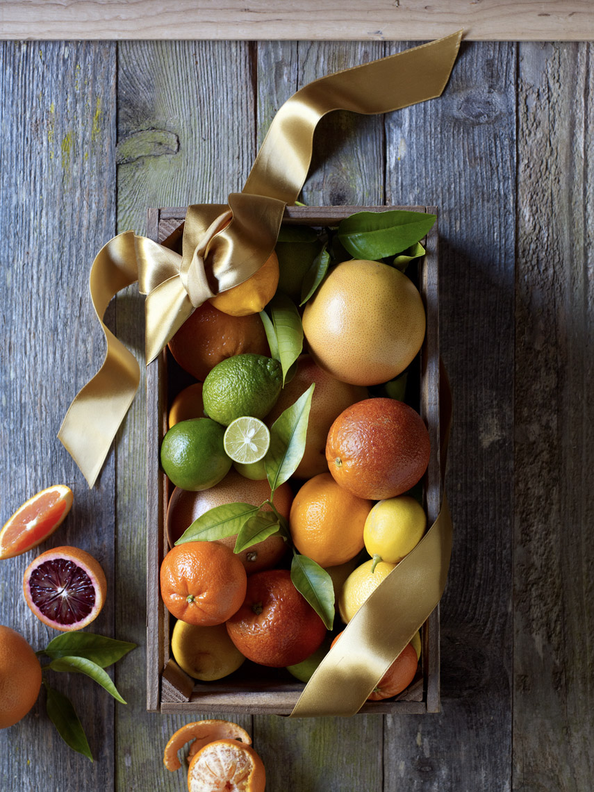 food stylist in San Francisco - Citrus in a crate - Grapefruits, bloodoranges, oranges, clementines, lemons, limes Sunset Magazine cover January photographed by Aya Bracket photographer