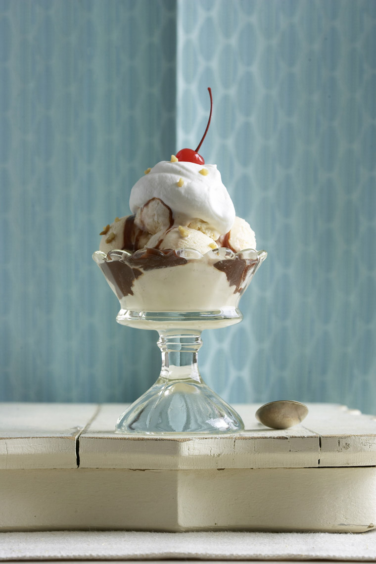 Robyn Valarik San Francisco Based Food & Drink Stylist - sundae, vanilla, ice-cream, hot, fudge, whipped-cream, cherry, old-fashioned, spoon, blue, table, food-photography