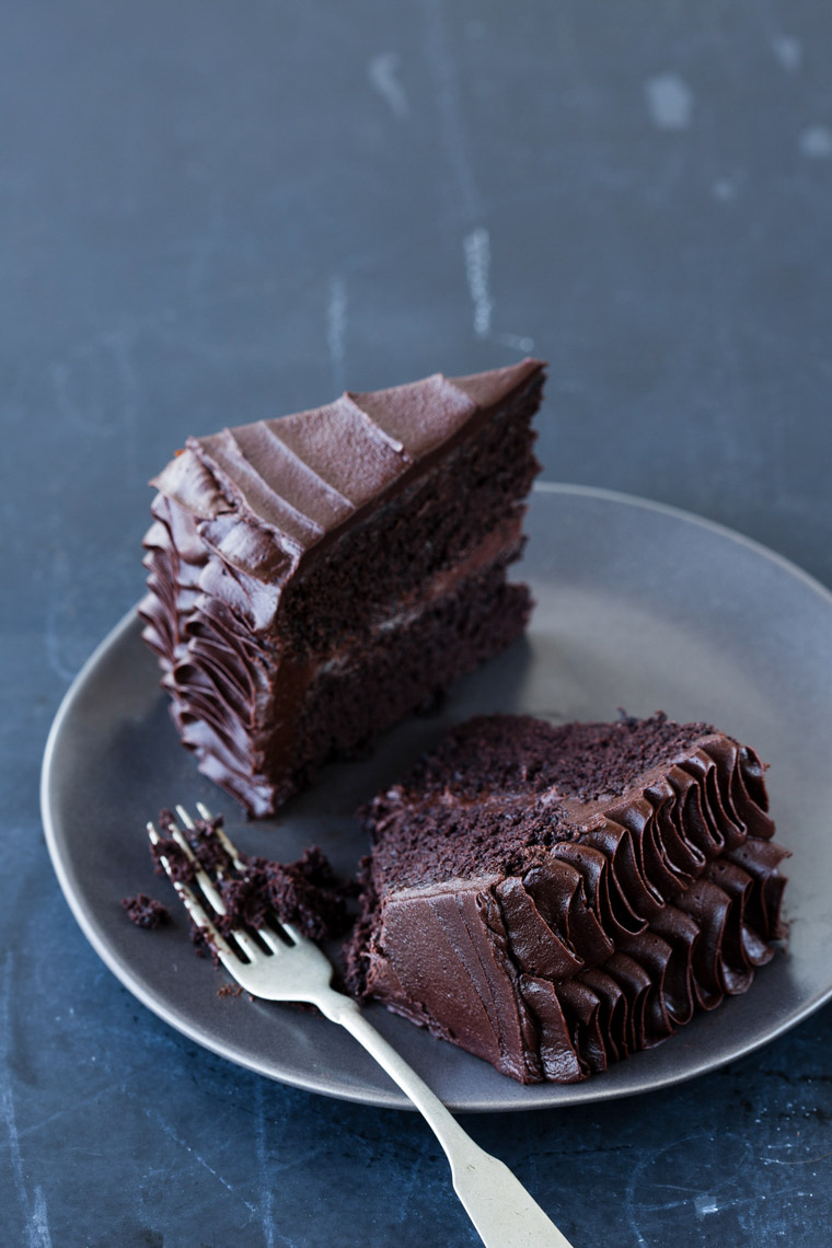food stylist in San Francisco - sliced Chocolate layer cake with piped chocolate ribbon frosting Let us All eat Cake cookbook - Catherine Ruehle author photographed by Erin Kunkel Photographer